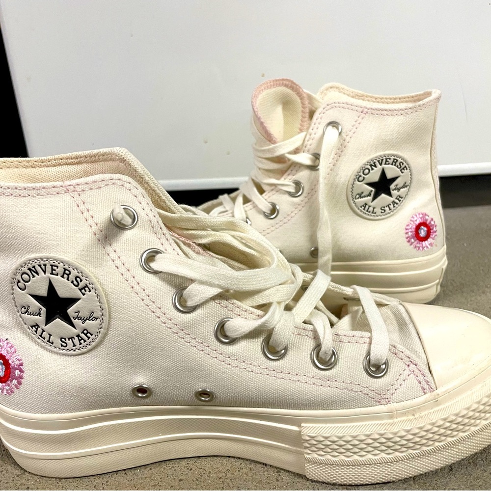 Converse Chuck Taylor All Star high lift embroidered canvas platform sneakers.